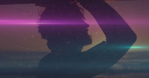 Silhouette of Bearded Man at Dusk with Atmospheric Lens Flares