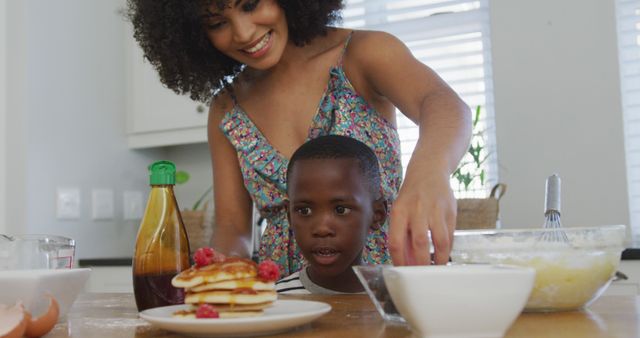 Mother and Son Preparing Pancakes in Modern Kitchen - Download Free Stock Images Pikwizard.com