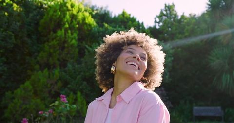 Joyful African American Woman in Lush Garden