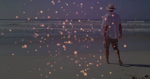 Man Strolling Along Beach With Star Overlay and Hat
