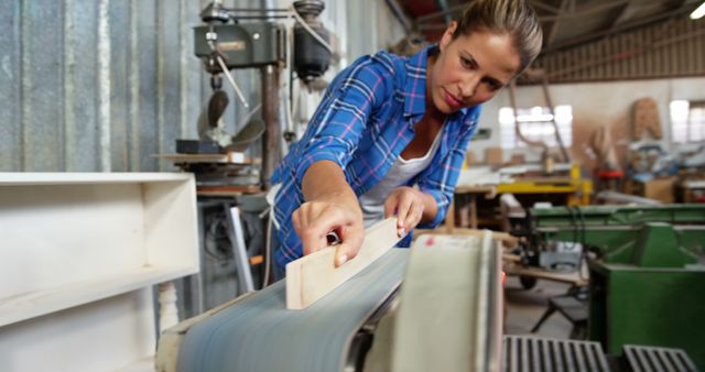 Woman Working in Wood Shop, Sanding Wood on Machine - Download Free Stock Images Pikwizard.com