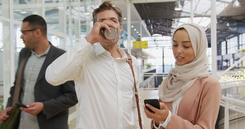 Diverse professionals navigating busy airport environment