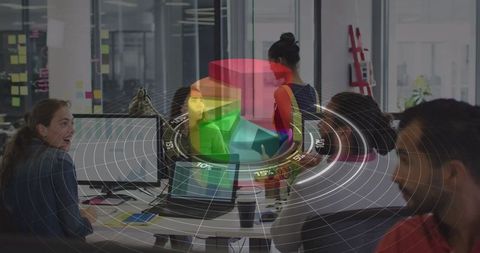 Diverse Team Analyzing Digital Data Graphics in Modern Office