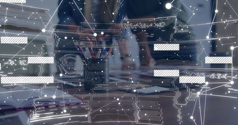 Collaborating professionals analyzing network data visualization on modern office desk