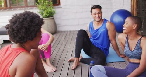 Diverse Friends Relaxing Post-Yoga Outdoors