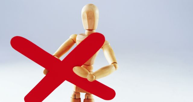 Wooden Mannequin Holding Red Cross Symbol Demonstrating Error Concept - Download Free Stock Images Pikwizard.com