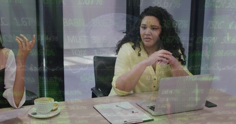 Business Meeting with Financial Data Interface Overlay