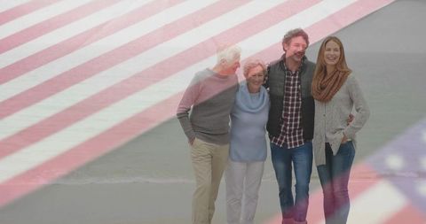 Multigenerational family embracing by shore with american flag overlay