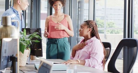 Diverse colleagues celebrating corporate success collaboratively