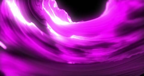 Abstract glowing pink light trails on black background