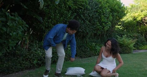 Joyful Couple Laughing Together in Lush Garden