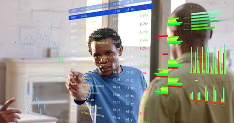Analyst pointing at interactive financial dashboards presenting data-driven insights