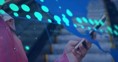 Commuter using smartphone on escalator with digital data overlay and city tech graph