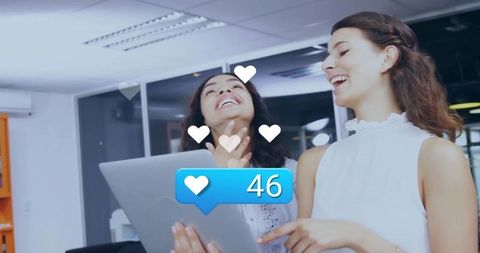 Colleagues Celebrating Social Media Success in Office Setting