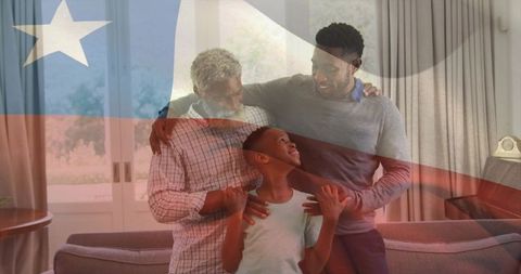Multigenerational family embracing child in cozy living room with transparent flag overlay