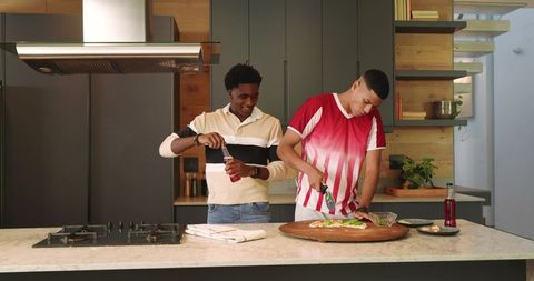 Diverse Friends Preparing Meal in Modern Kitchen Together