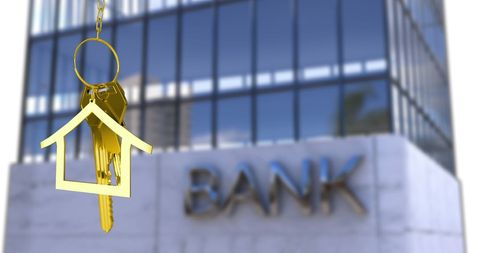 House Shaped Keychain and Modern Bank Building Symbolizing Real Estate Finance