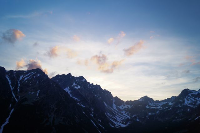 Black Mountain With White Snow Under Blue Sky - Download Free Stock Photos Pikwizard.com
