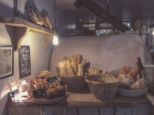 Cozy Artisan Bakery Display with Freshly Baked Bread - Download Free Stock Photos Pikwizard.com