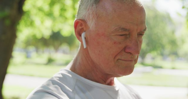 Senior Man Enjoying Music Outdoors with Wireless Earbuds - Download Free Stock Images Pikwizard.com