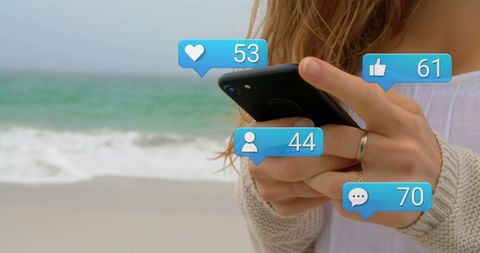 Woman Engaging on Social Media at Beach - Download Free Stock Images Pikwizard.com