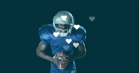 Football player in studio with heart icons, exemplifying passion