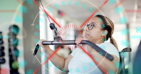 Determined wheelchair user doing lat pulldown with HUD overlay promoting adaptive fitness