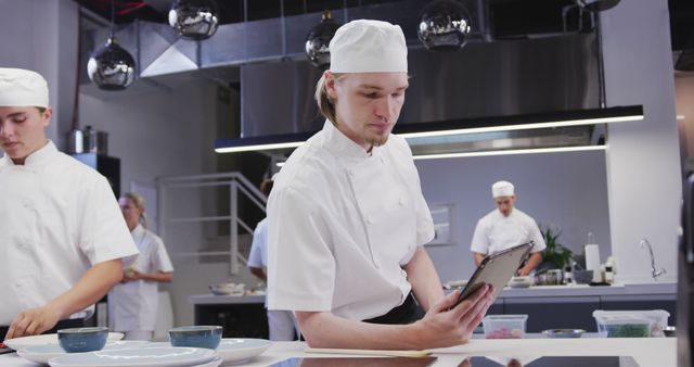 Professional Chefs Working in Modern Kitchen with Digital Tablet - Download Free Stock Images Pikwizard.com