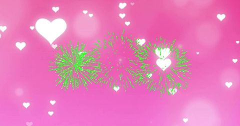 Neon green fireworks lighting pink heart bokeh for romantic celebration and party