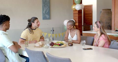 Diverse Friends Celebrating Together with Snacks and Drinks
