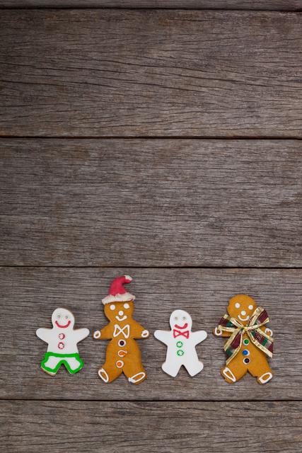 Various types of gingerbread arranged together on a plank