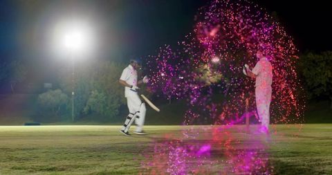 Batsman walking off pitch under floodlights holding bat night cricket match with pink sparkle effect