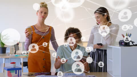 Diverse Team in Office Connecting Digitally