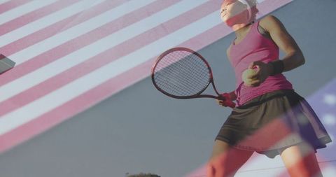 Determined tennis player preparing serve overlaid with american flag