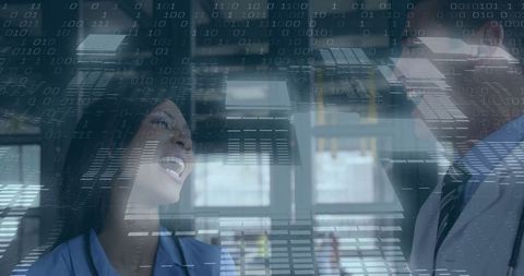 Colleagues sharing a light moment in tech-inspired office