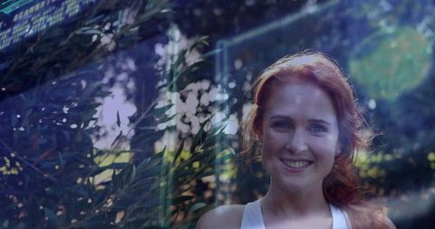 Red-Haired Woman in Garden Amid Futuristic Technology Elements