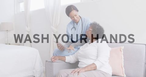 Nurse Assisting Senior Patient With Digital Tablet