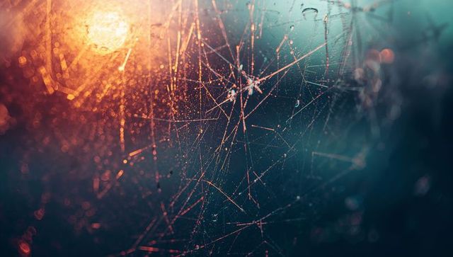 Mystical Cracked Glass Under Warm Orange Glow with Bokeh