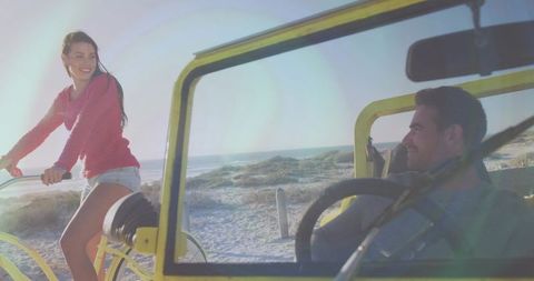 Sunlit beach buggy romance smiling couple enjoying sun-kissed coastal dune ride at sunset