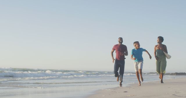 Happy Family Running on Beach During Sunset - Download Free Stock Images Pikwizard.com