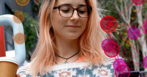 Young Woman Embracing Technology with Coffee and Digital Connections