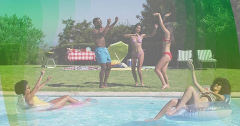 Energetic Friends Dancing Freely at Poolside Get-Together