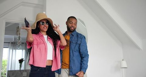 Happy Couple Preparing for Vacation at Home