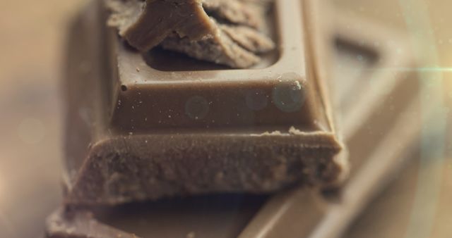 Close-Up of Broken Milk Chocolate Bar with Light Effects - Download Free Stock Images Pikwizard.com