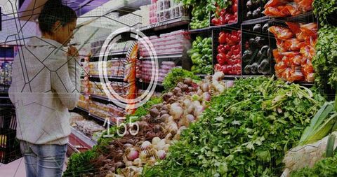Woman browsing fresh vegetables in supermarket