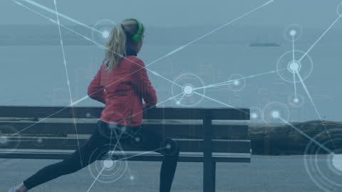 Female Jogger Stretching by Sea with Futuristic Network Overlay
