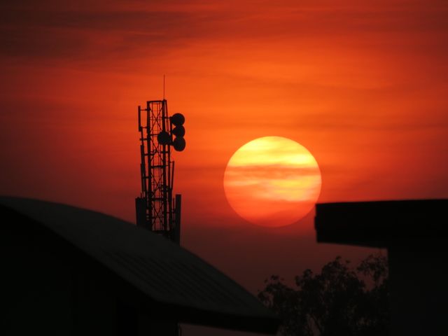 Sunset View with Silhouetted Communication Tower - Download Free Stock Photos Pikwizard.com