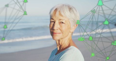 Senior Woman Enjoying Beach with Digital Connection Overlay