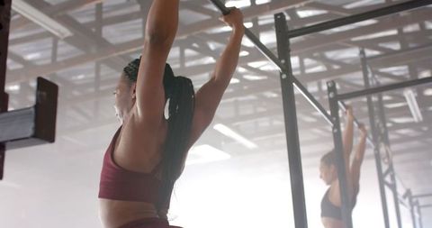 Women Training on Pull-Up Bars for Upper Body Strength