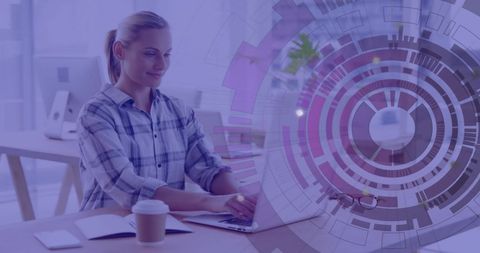 Businesswoman Analyzing Data on Laptop in Futuristic Office